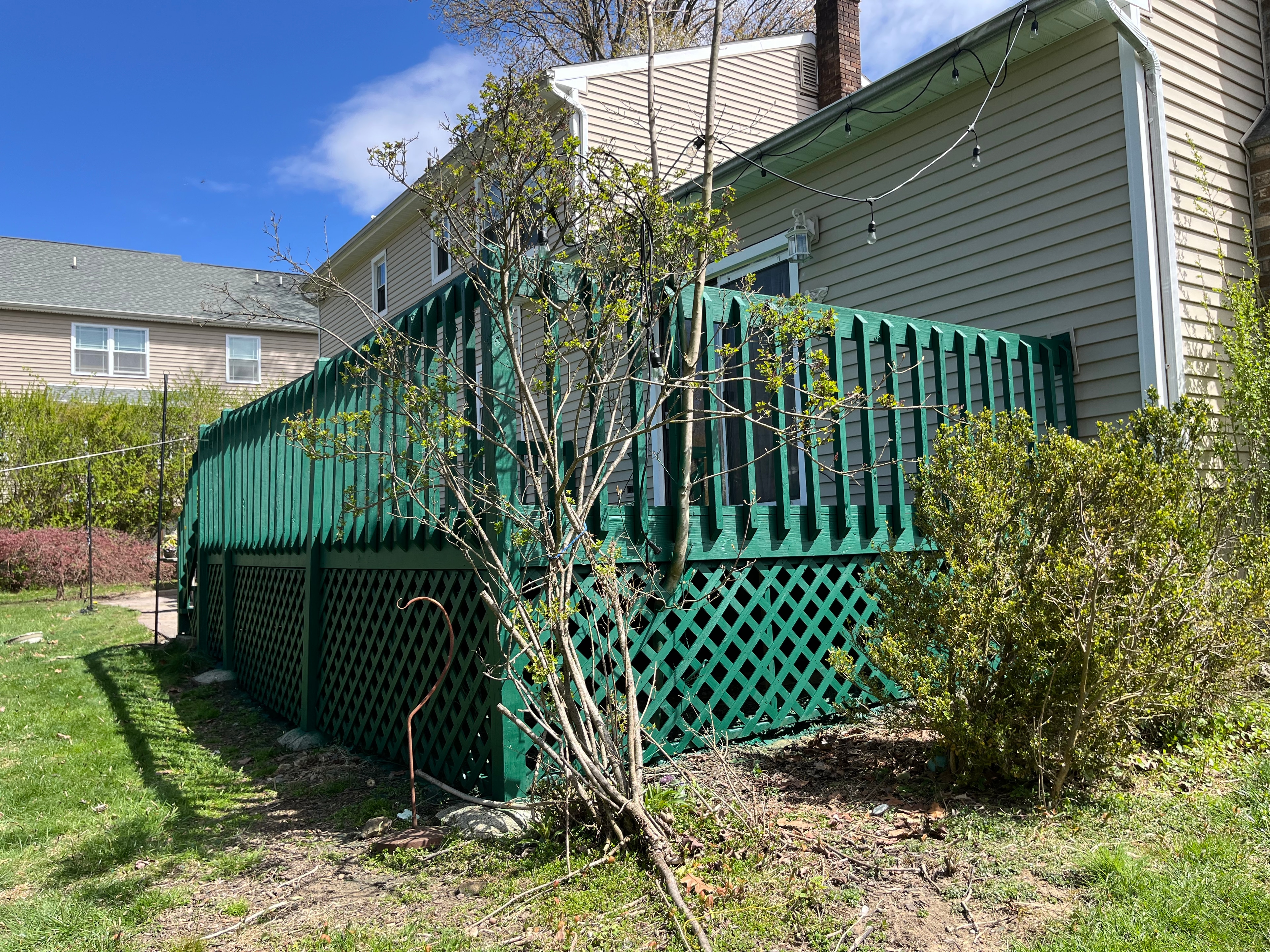 Custom green deck staining with professional lattice work