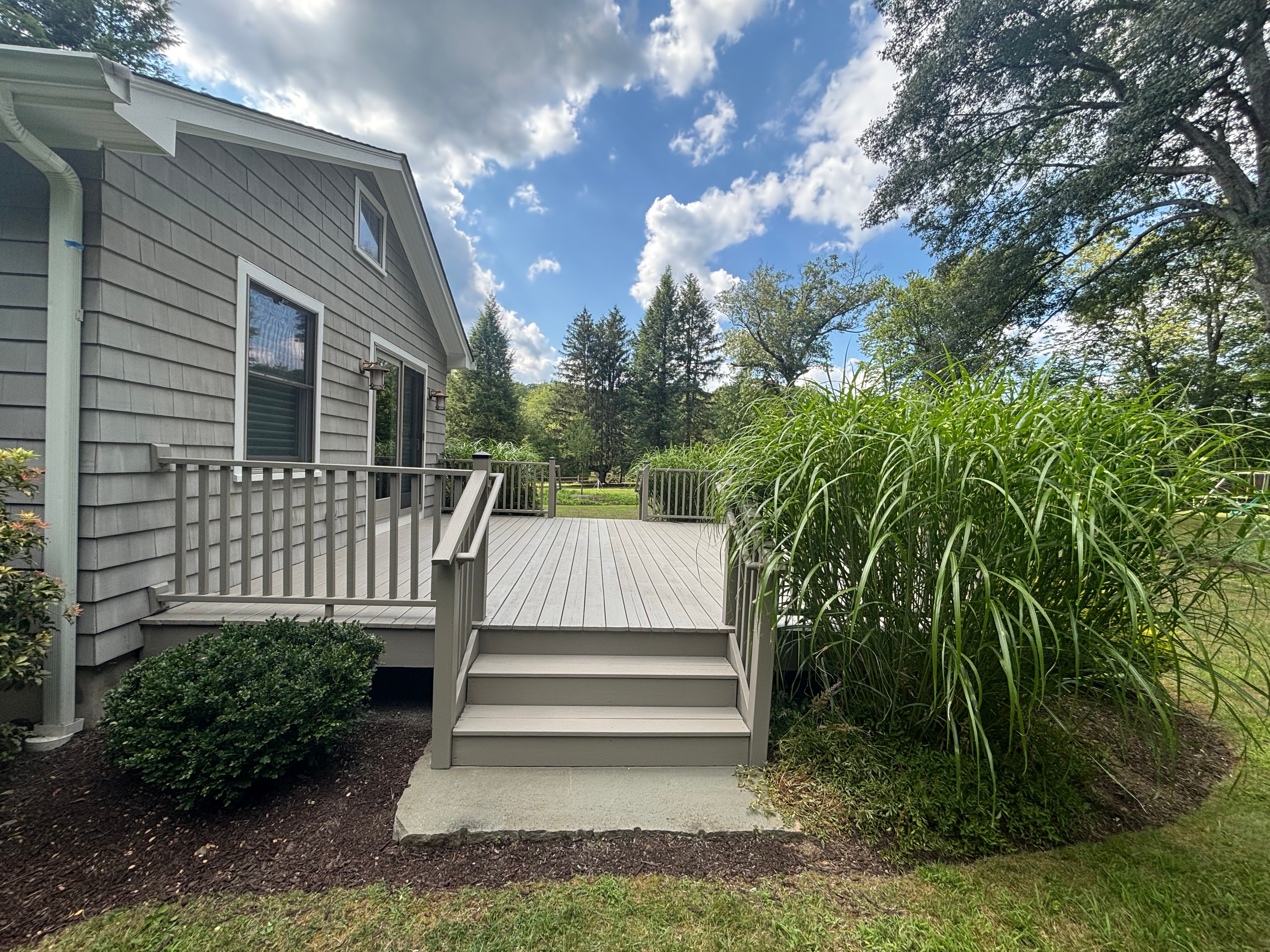 Spacious white deck with blue sky backdrop